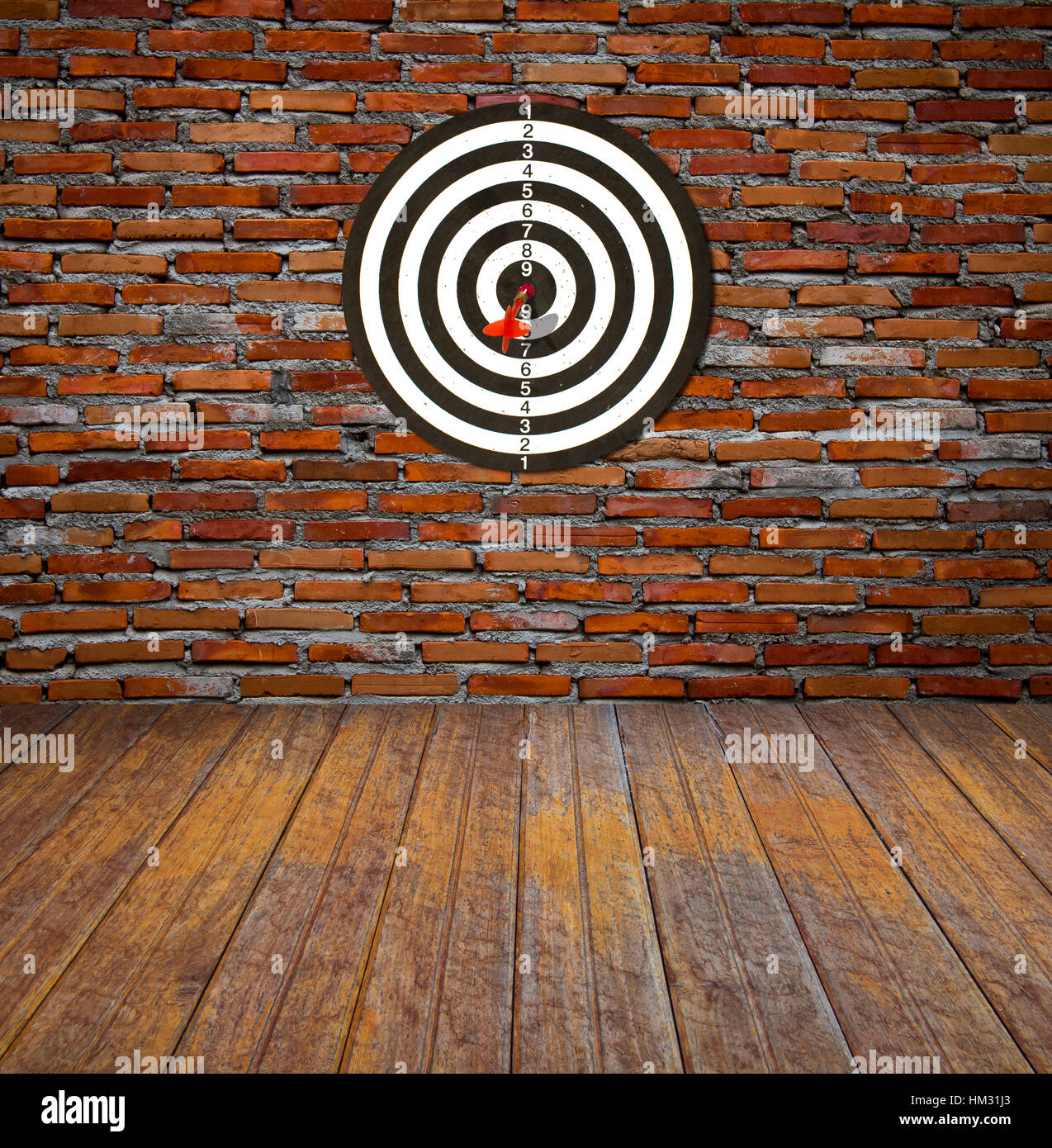 Dartboard on brick wall (miss darts Stock Photo Alamy