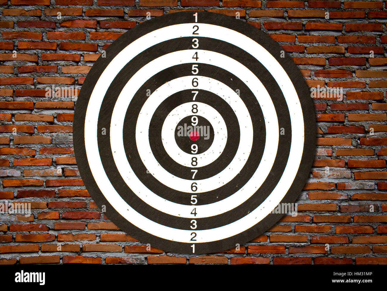 Dartboard on brick wall (Darts Hit Target Stock Photo Alamy