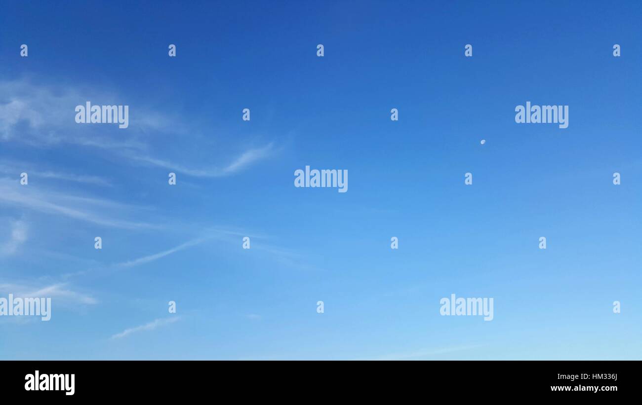 Clear blue sky with soft white cloud Stock Photo - Alamy