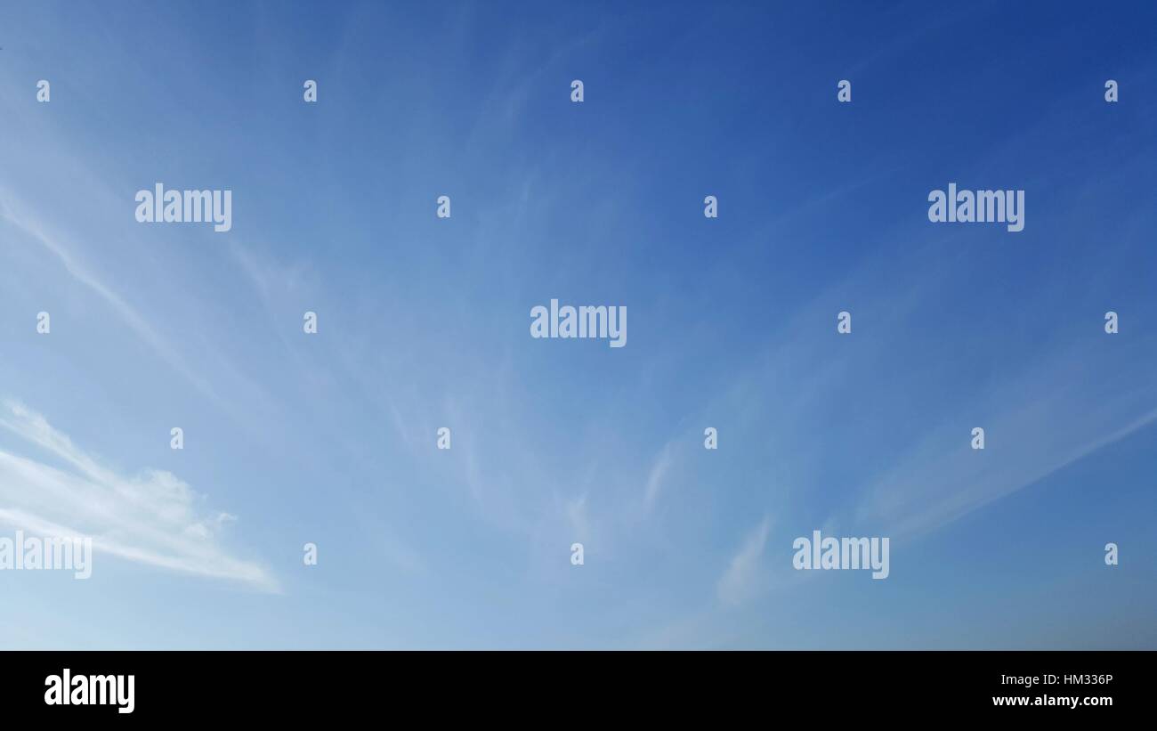 Clear blue sky with soft white cloud Stock Photo - Alamy