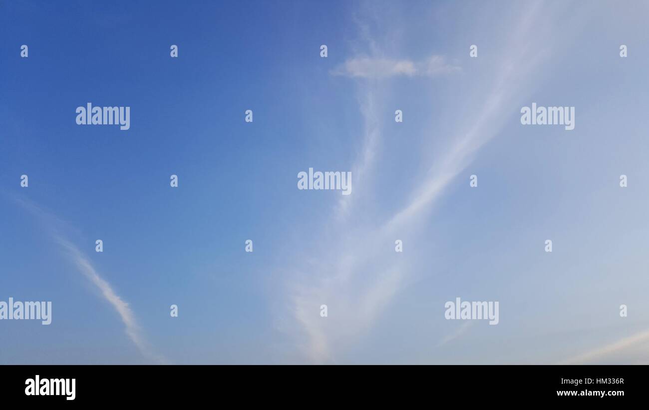 Clear blue sky with soft white cloud Stock Photo - Alamy