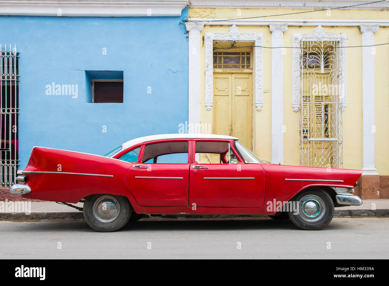 Classic American car parked in old town Trinidad, Cuba Stock Photo