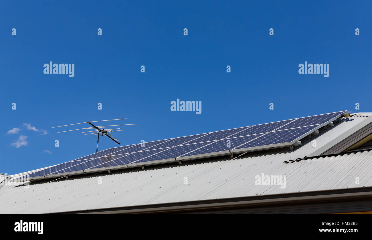 Solar Panels installed on metal roof. Stock Photo