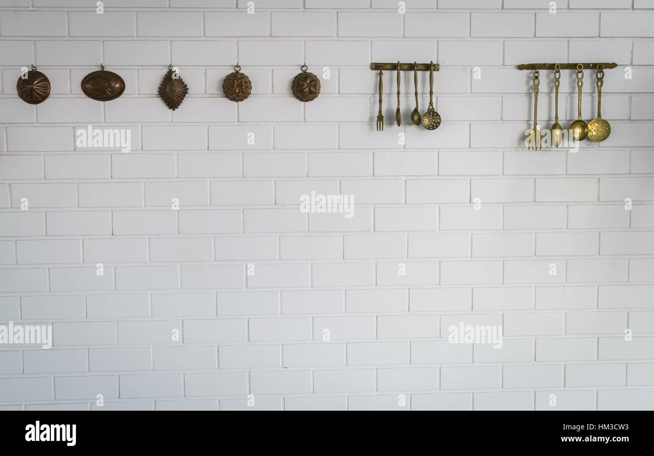 kitchen spoon and fork hanging on wall Stock Photo Alamy