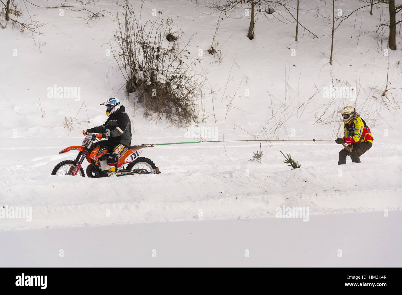 Motorcycle skijoring racers ride on track of Czech championship competition on January 29, 2017 in Klasterec nad Orlici, Czech republic. Stock Photo