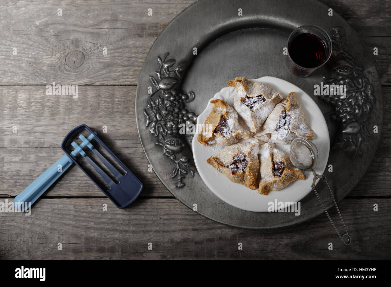 Jewish Pastry Hamantaschen and ratchet for Purim Holiday Stock Photo