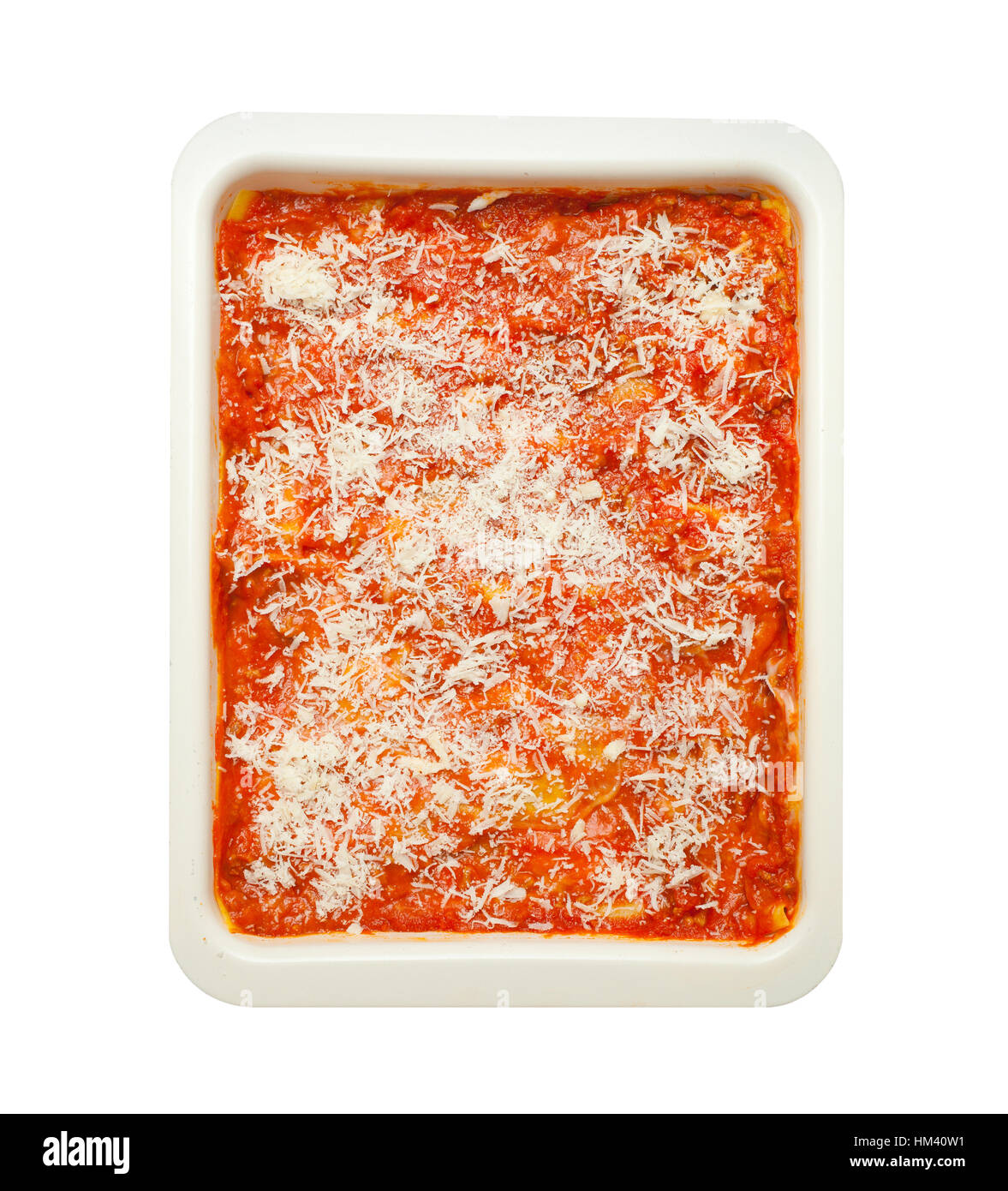 Homemade lasagna isolated on white background. Italian pasta recipe with tomato sauce and minced meat. Stock Photo