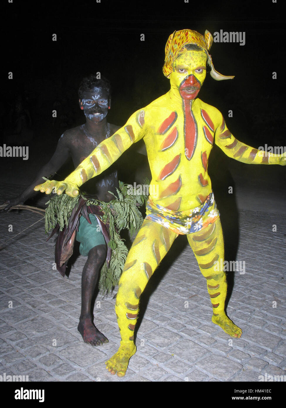 Pulikali dancers painted in yellow and black and resemble a tiger. They dance to the tune of thakil and chedna. Onam Festival, Kerala, India Stock Photo