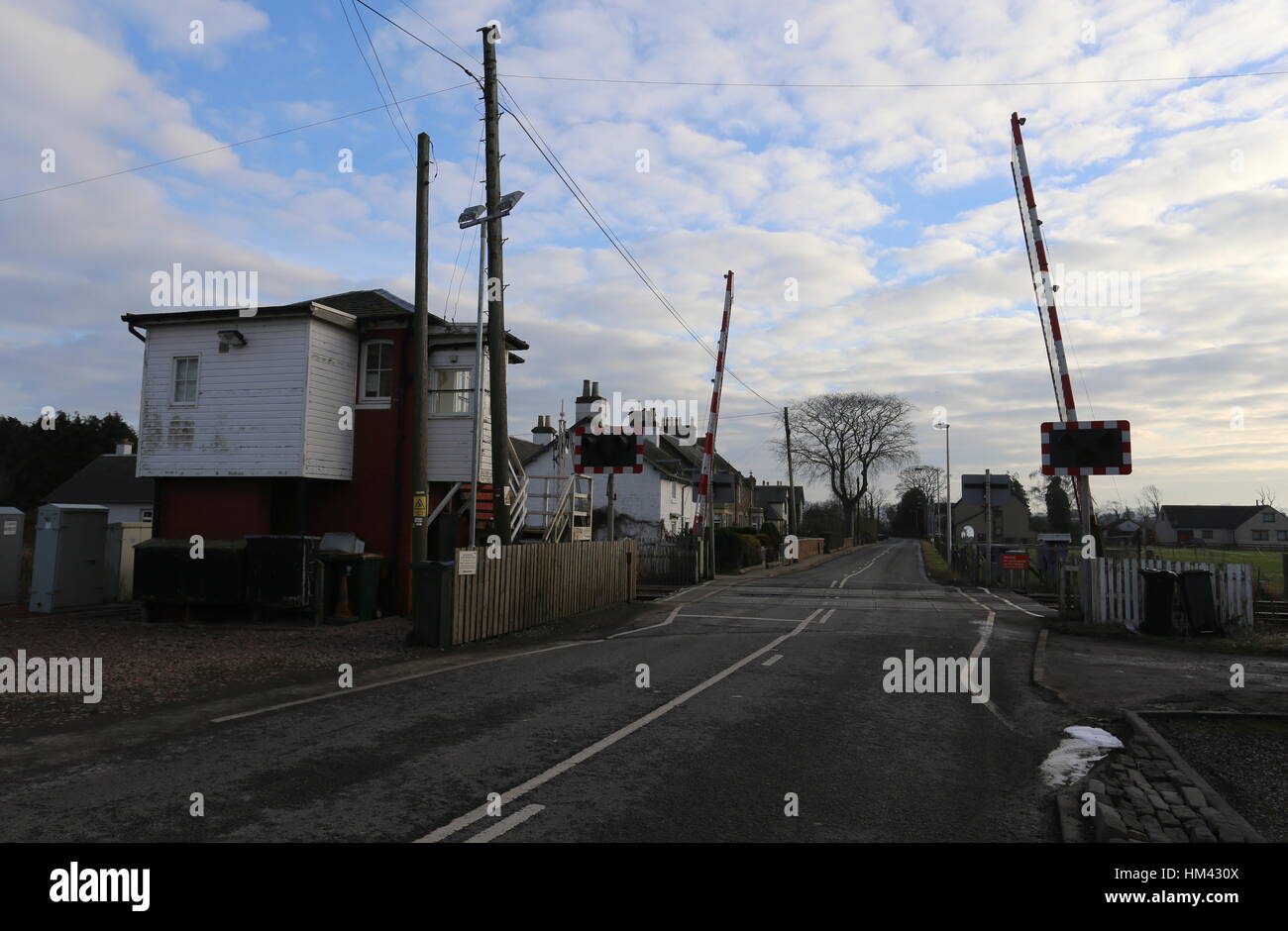 Level crossing with raised barriers Errol Station Scotland January 2017 Stock Photo