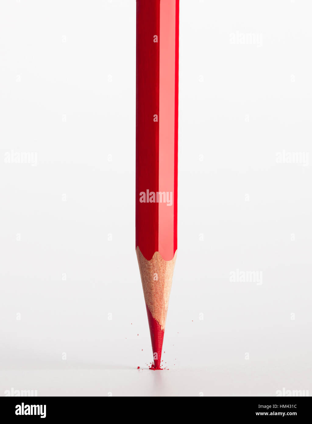 Broken tip of red pencil isolated on white background. Stock Photo