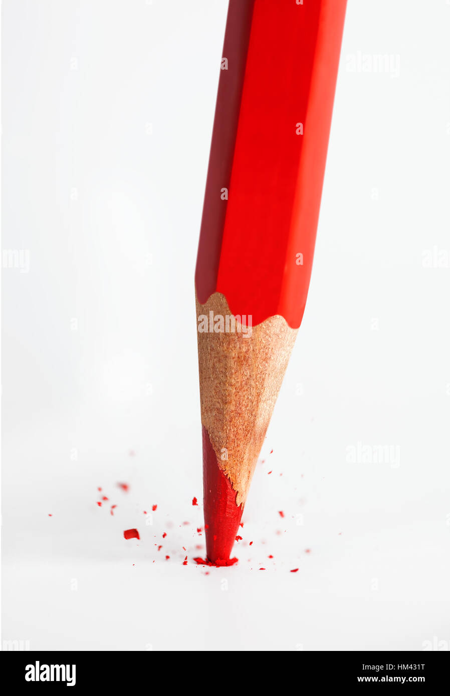 Broken tip of red pencil isolated on white background. Stock Photo