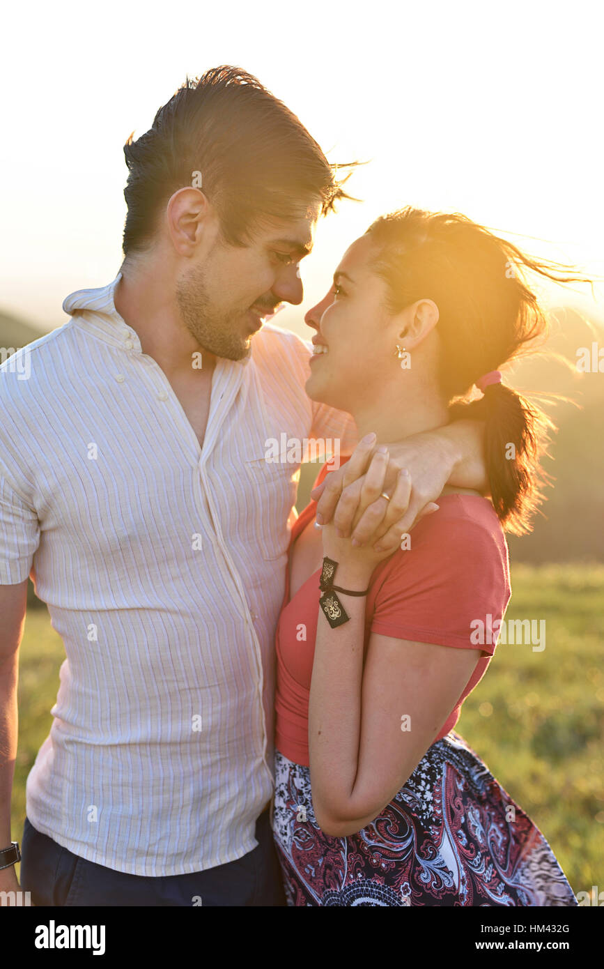 Couple in love look on each other in sun light Stock Photo