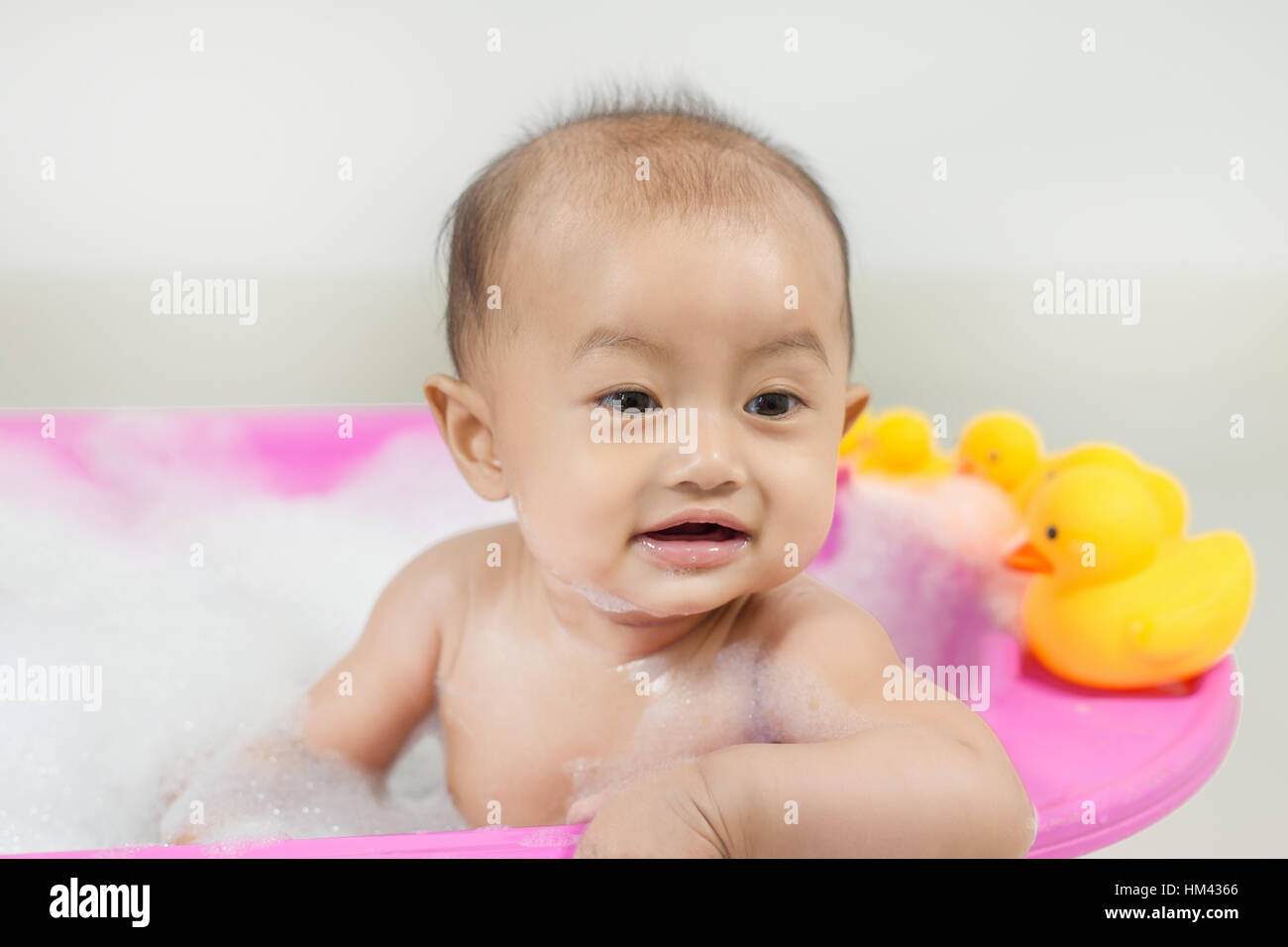 Happy baby taking bath playing hires stock photography and images Alamy