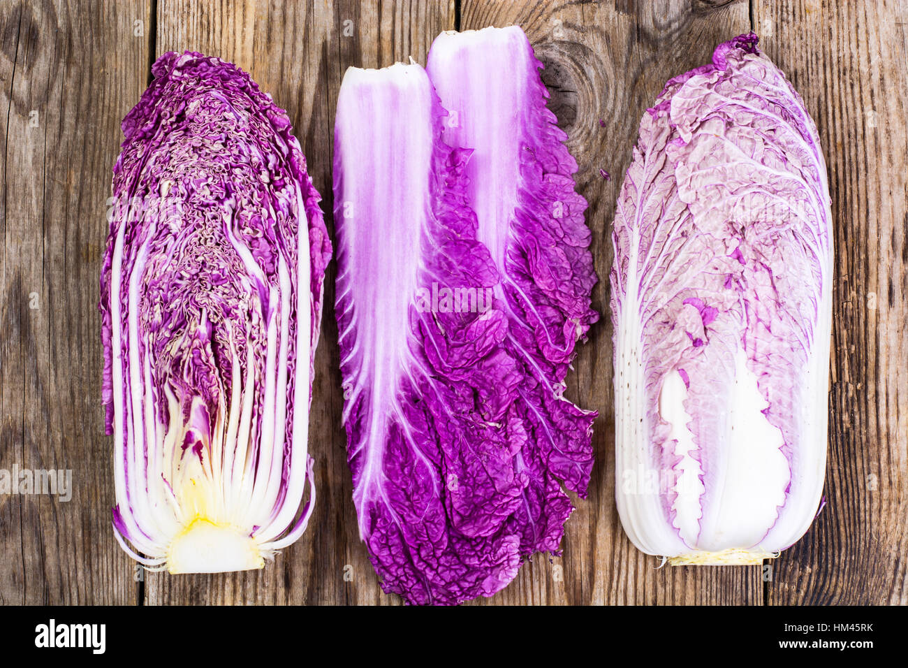 Cut red bok choy on a wooden background Stock Photo - Alamy