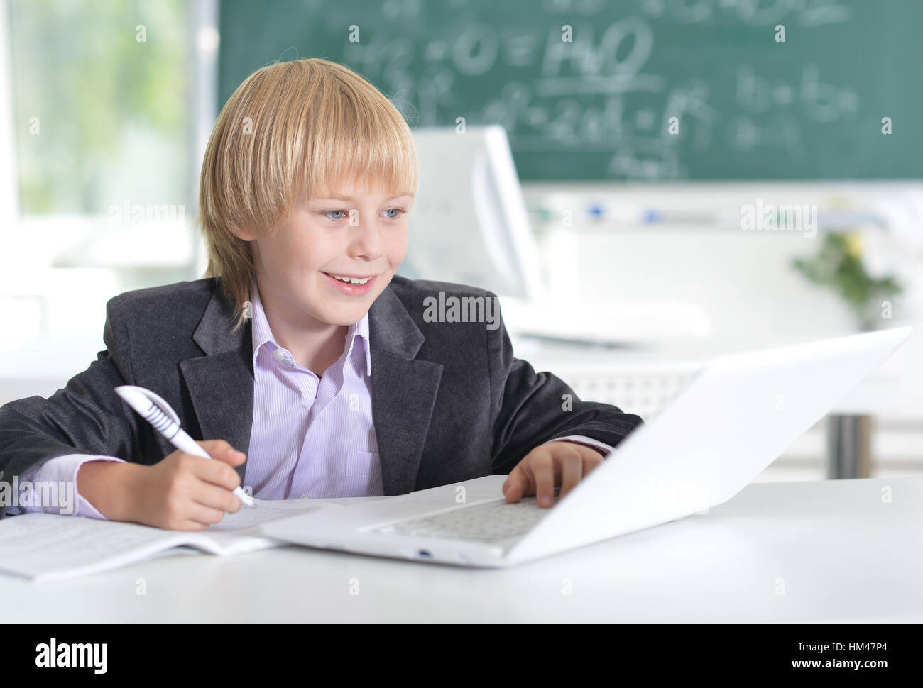 cute little boy using laptop Stock Photo - Alamy