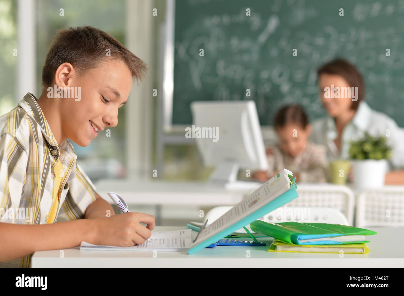 Boy Learning Lesson teenage boy doing lessons Stock Photo - Alamy