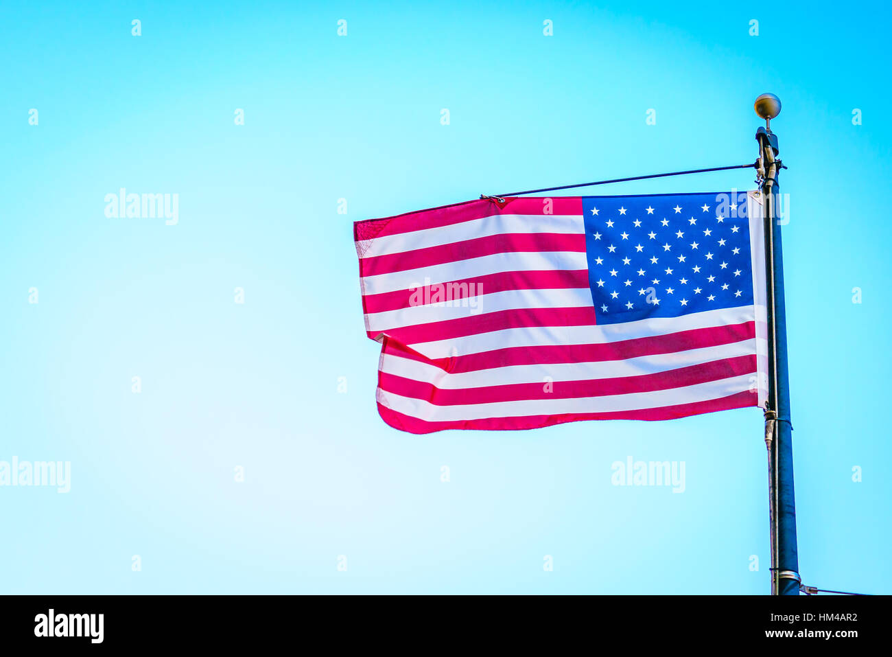 American flag on blue sky Stock Photo - Alamy