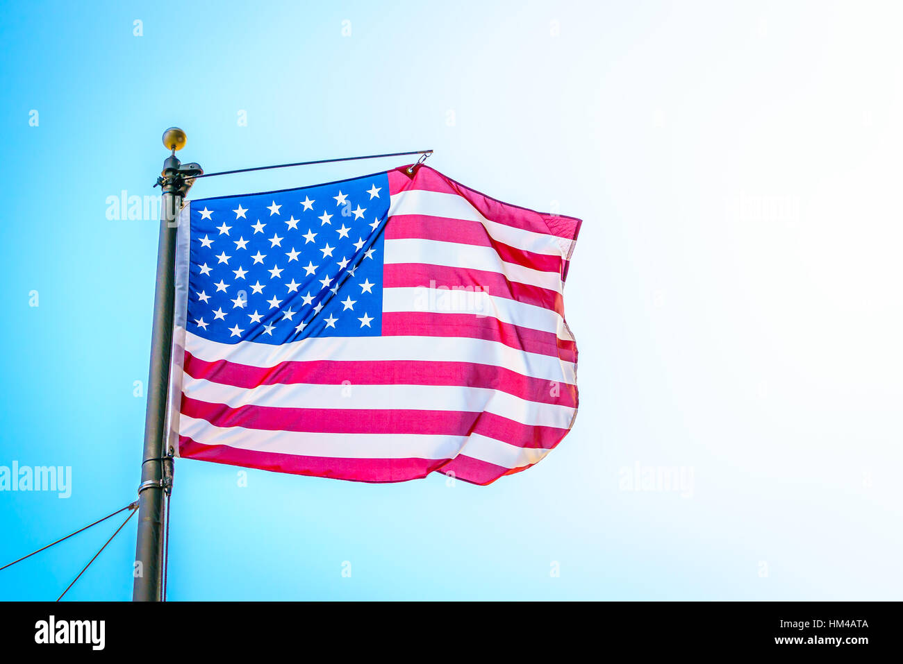 American flag on blue sky Stock Photo Alamy