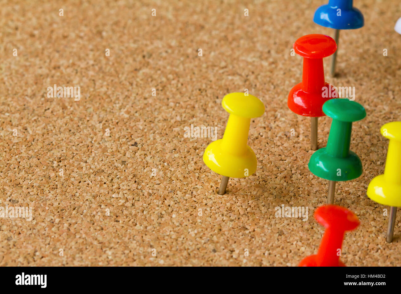 Group of colorful push pins on cork bulletin board Stock Photo Alamy