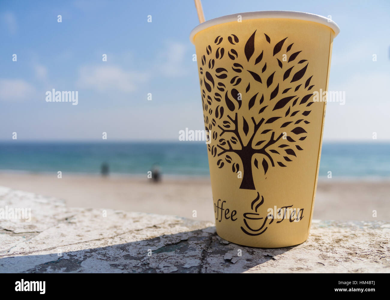 paper cup with a drink on the beach Stock Photo - Alamy