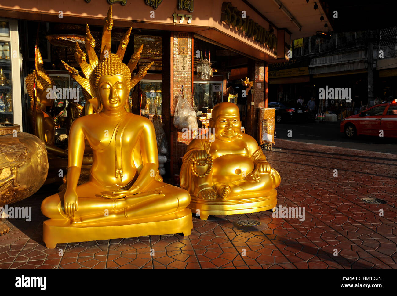 Large golden Buddha statues outside store in Bangkok Stock Photo Alamy