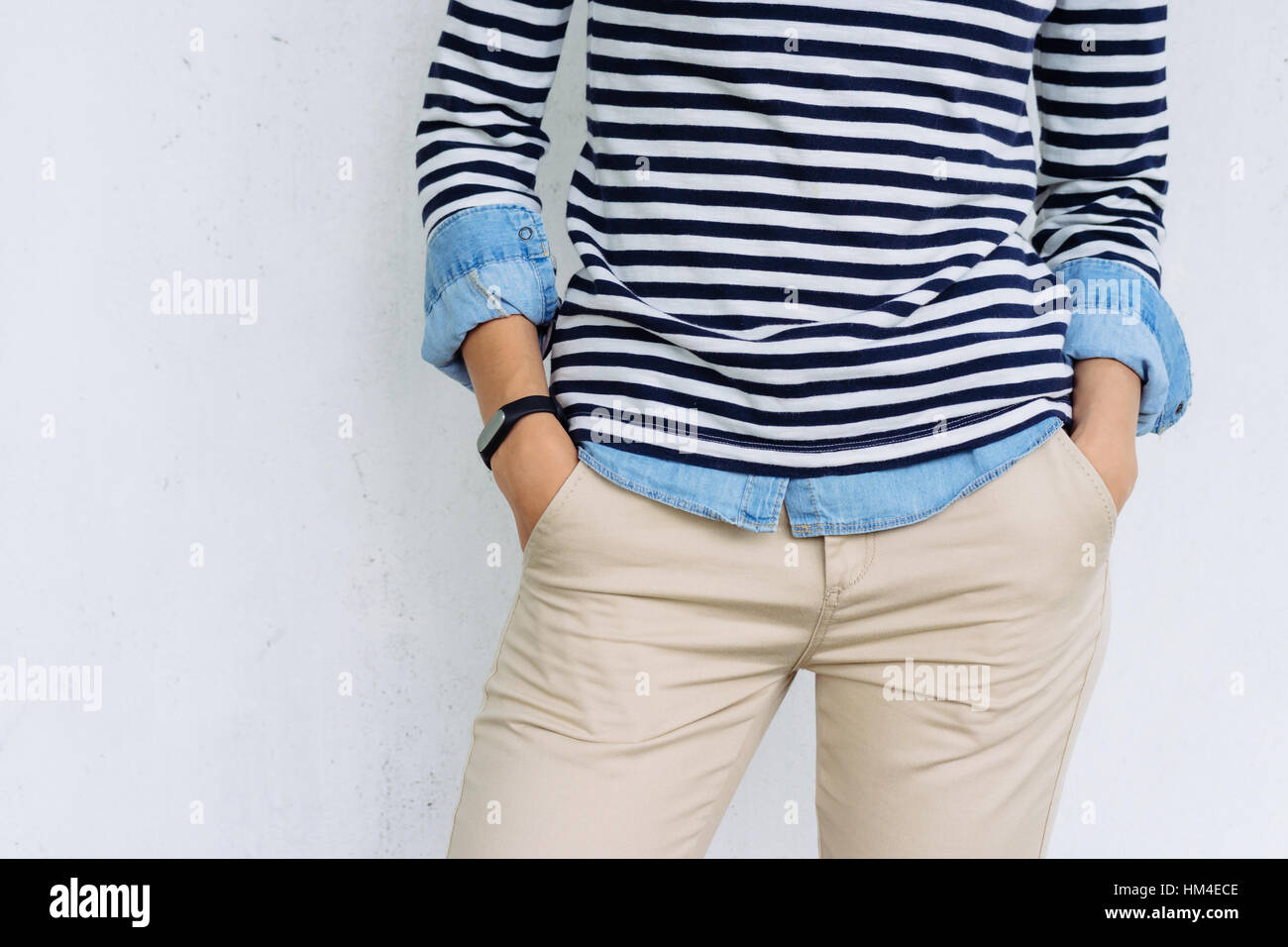 beige pants with a fitness tracker 