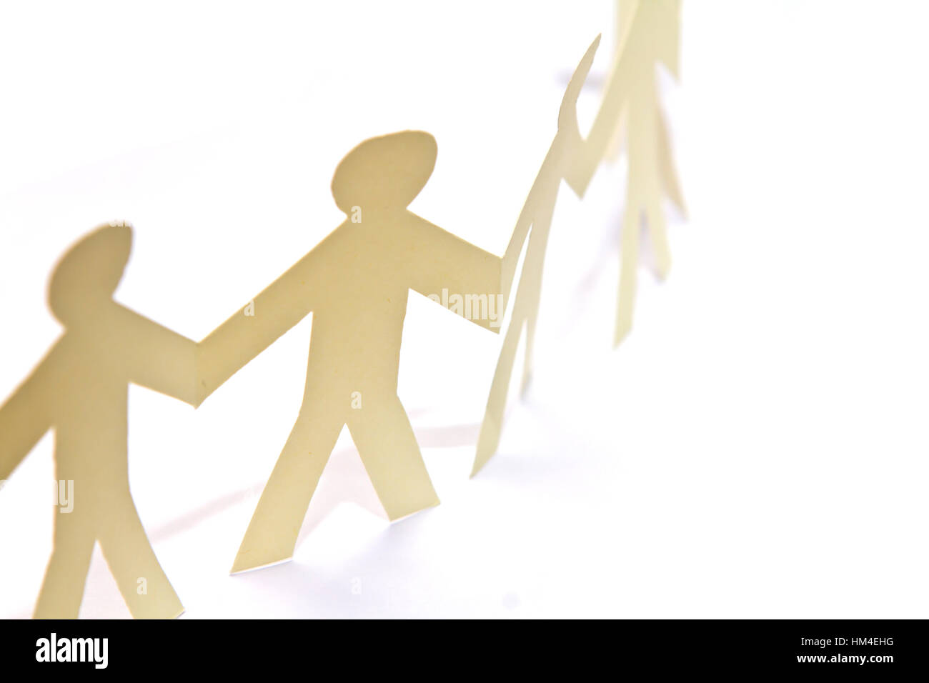 Cutout paper people over white background Stock Photo - Alamy