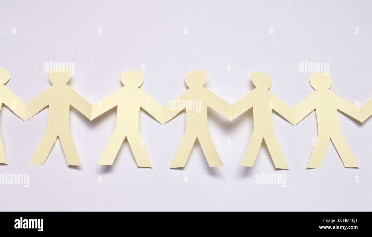 Cutout paper people over white background Stock Photo - Alamy