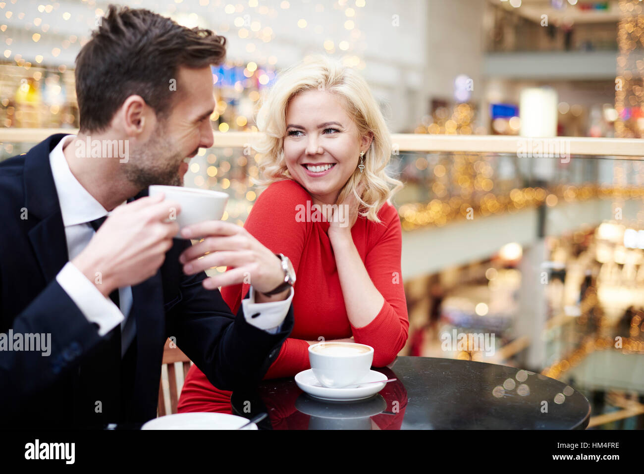 Couple having a date on the shopping centre Stock Photo