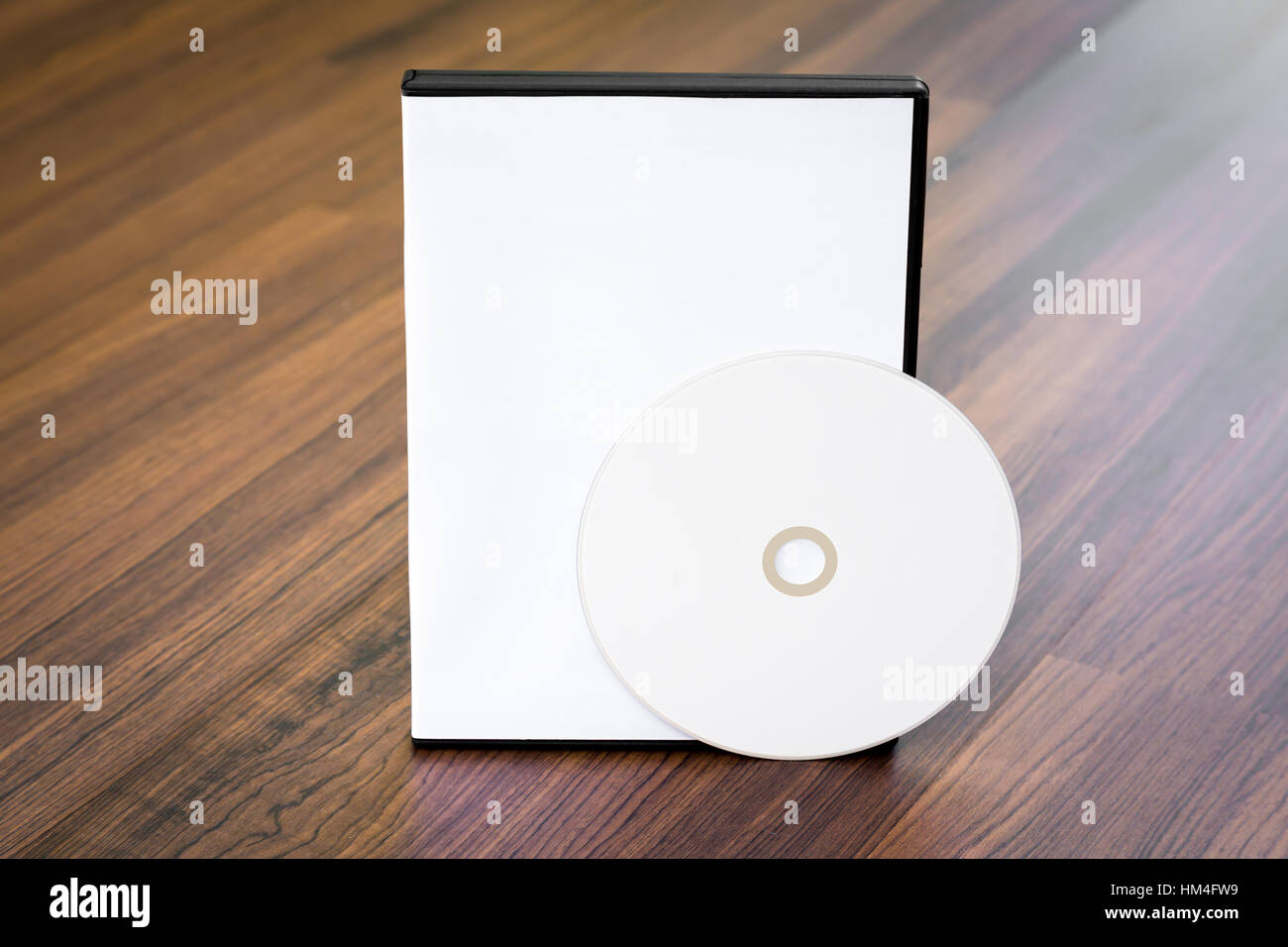 Blank compact disc with cover on wood background ground Stock Photo - Alamy