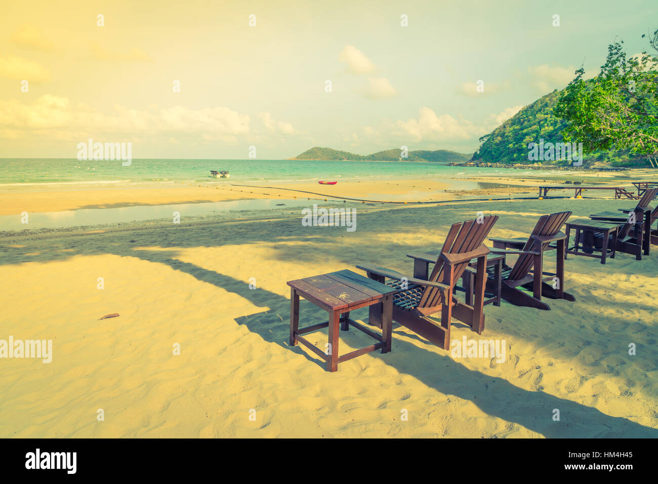 Beautiful beach chairs on tropical white sand beach Stock Photo - Alamy