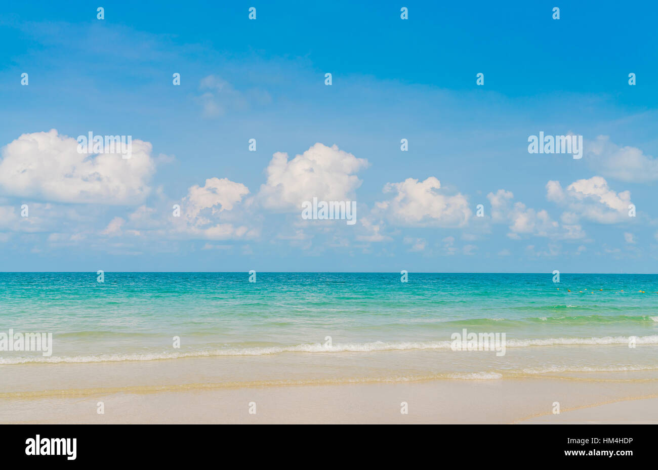 Beautiful white sand beach with blue sea and sky Stock Photo - Alamy