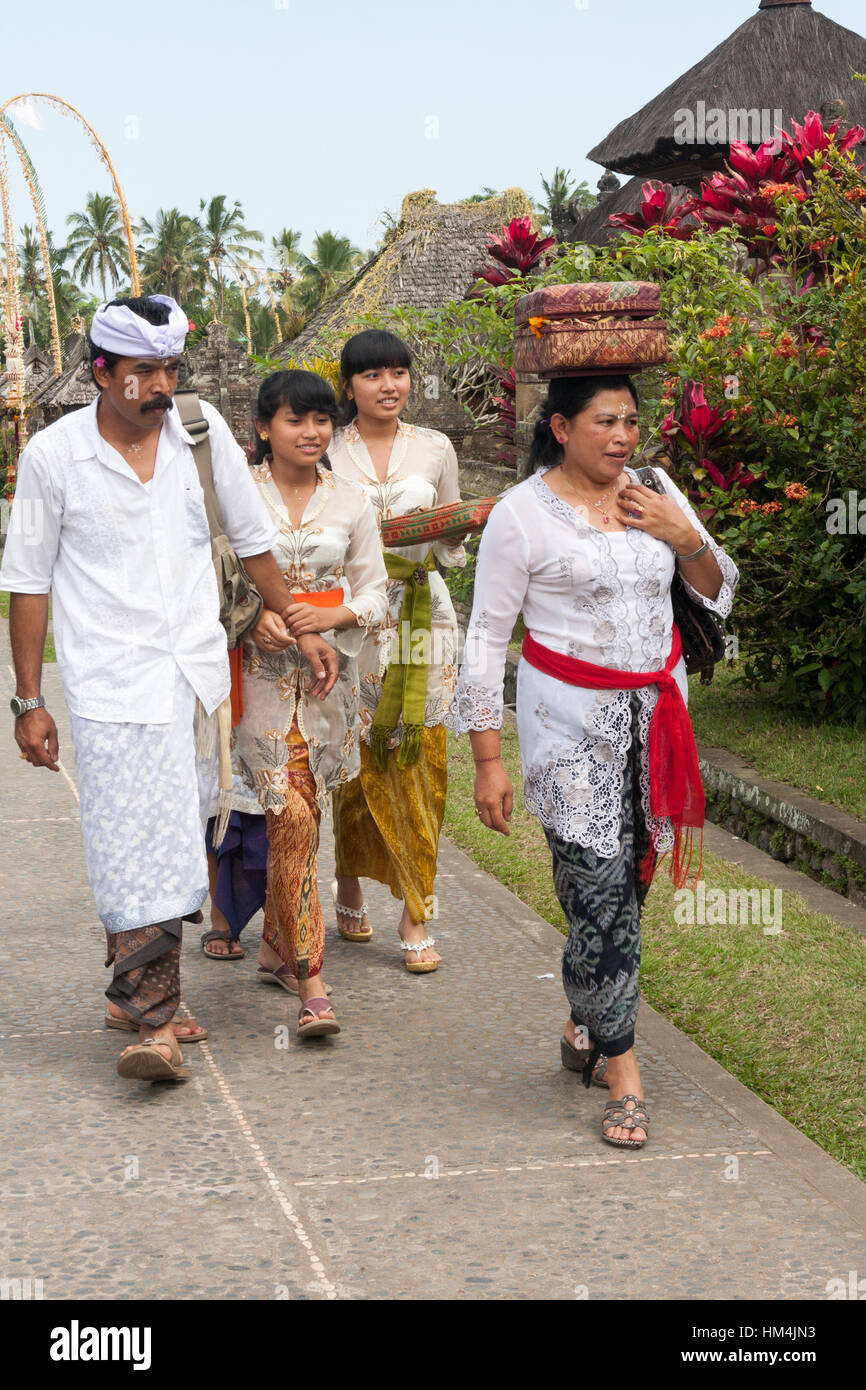 Family on its way to the temple during the Galungan festival in Bali, Indonesia Stock Photo