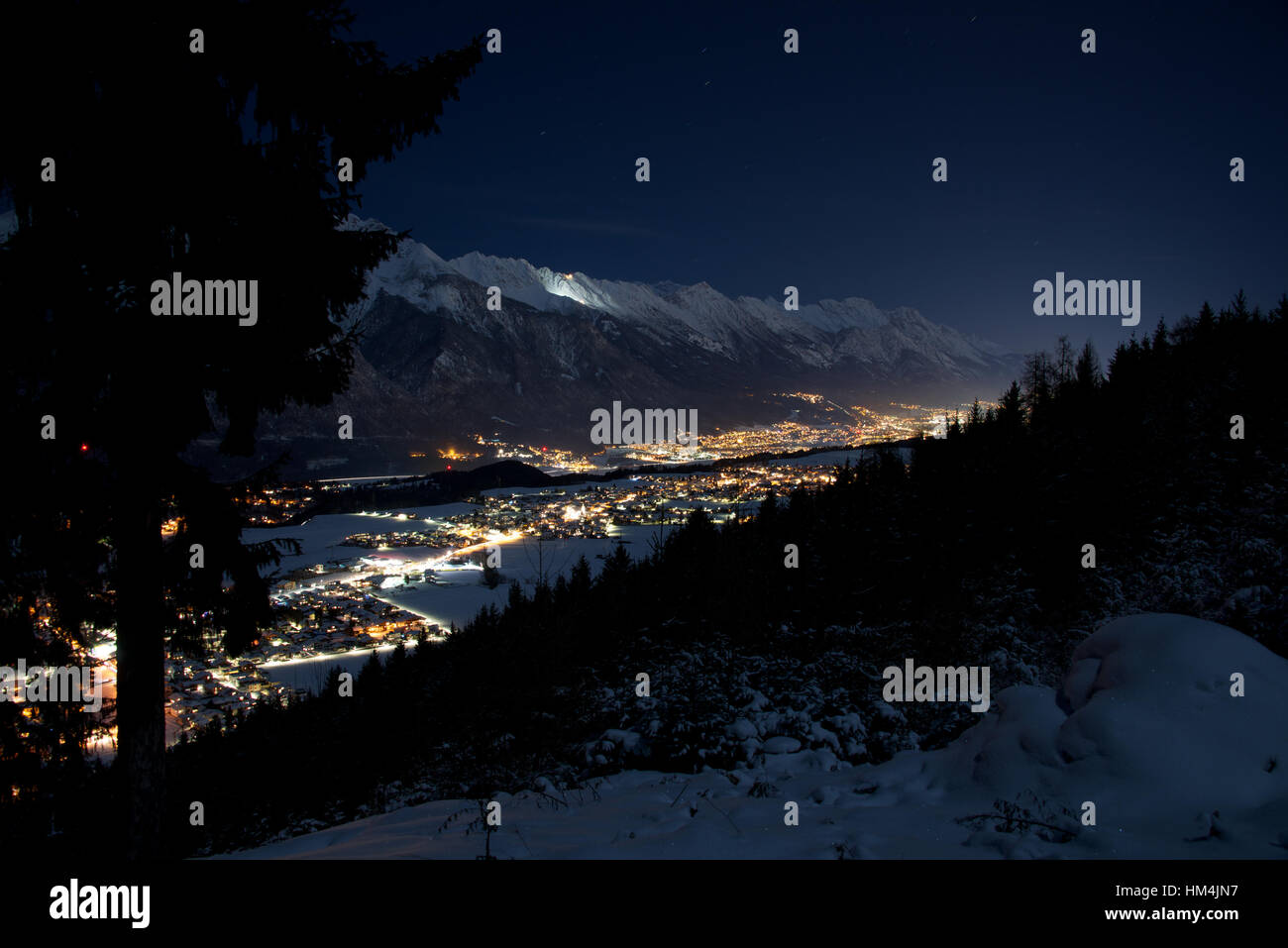 Innsbruck and the Inn Valley at night in winter. Tirol, Austria Stock Photo