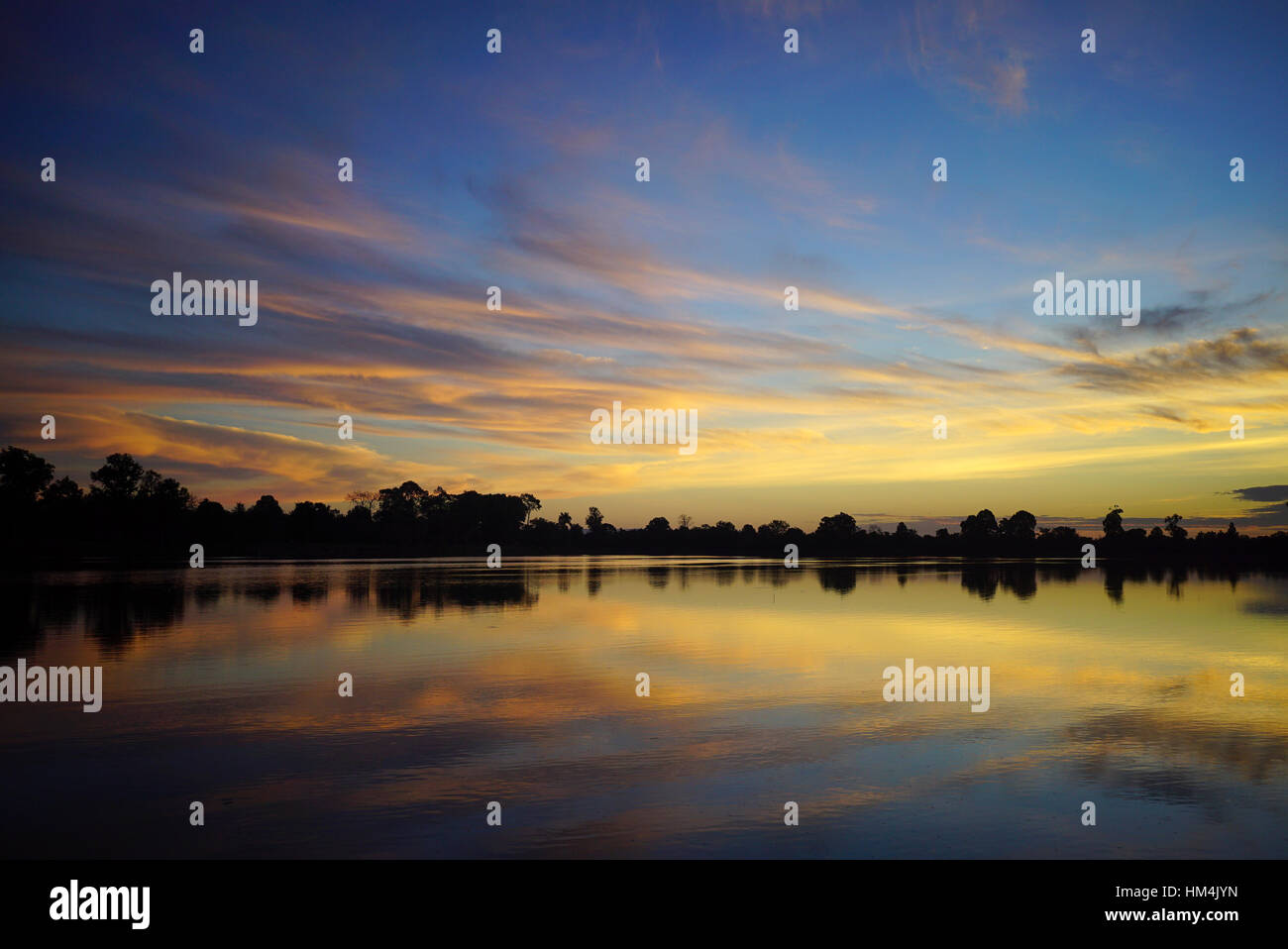 Sunrise at one of the many lakes in Angkor, Siem Riep province, Cambodia Stock Photo