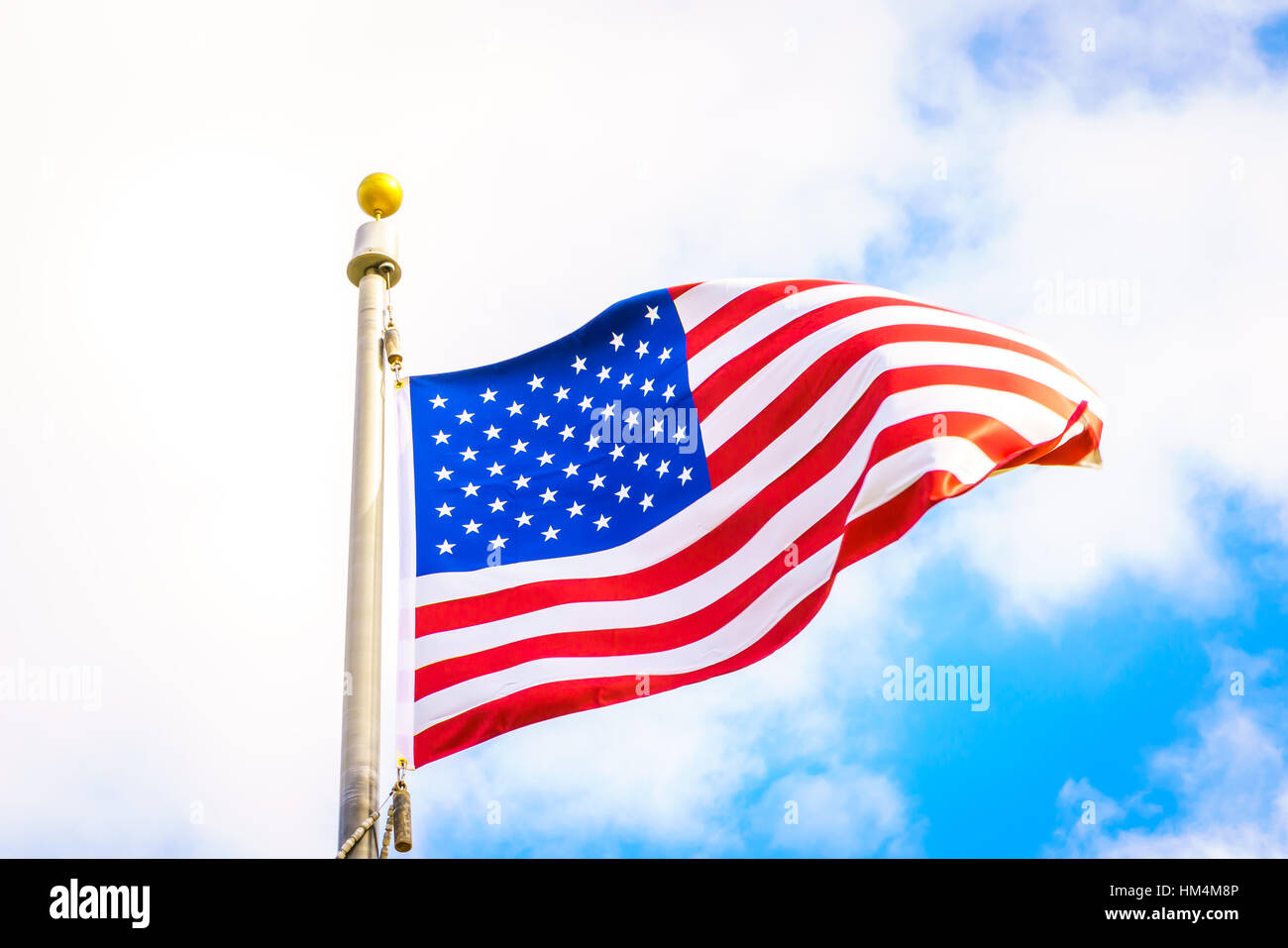 American flag on blue sky Stock Photo - Alamy