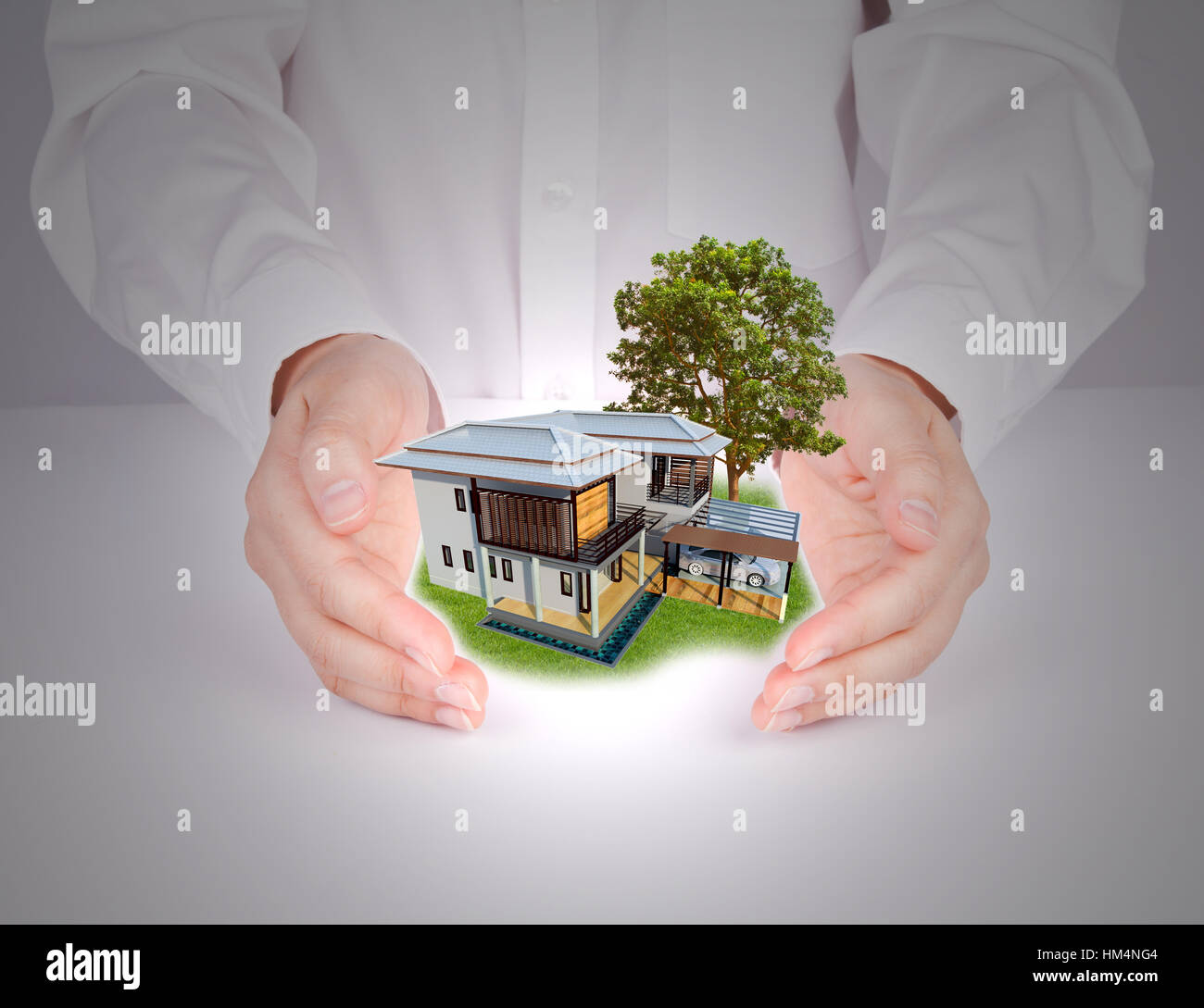 Business hand holding house Stock Photo - Alamy