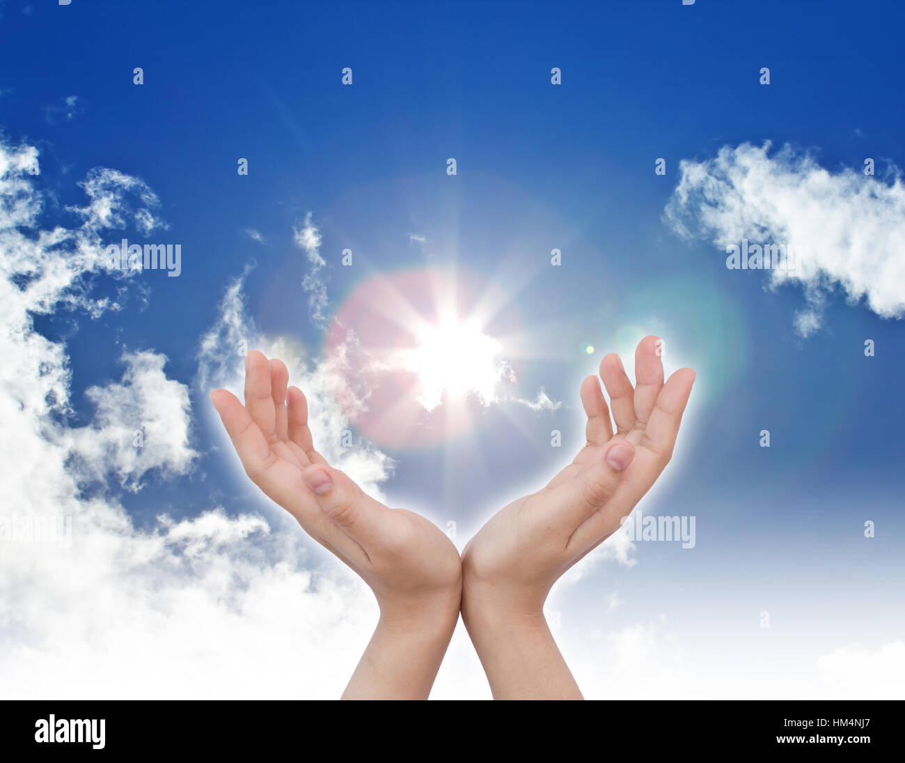 hand sun and blue sky with copyspace Stock Photo - Alamy