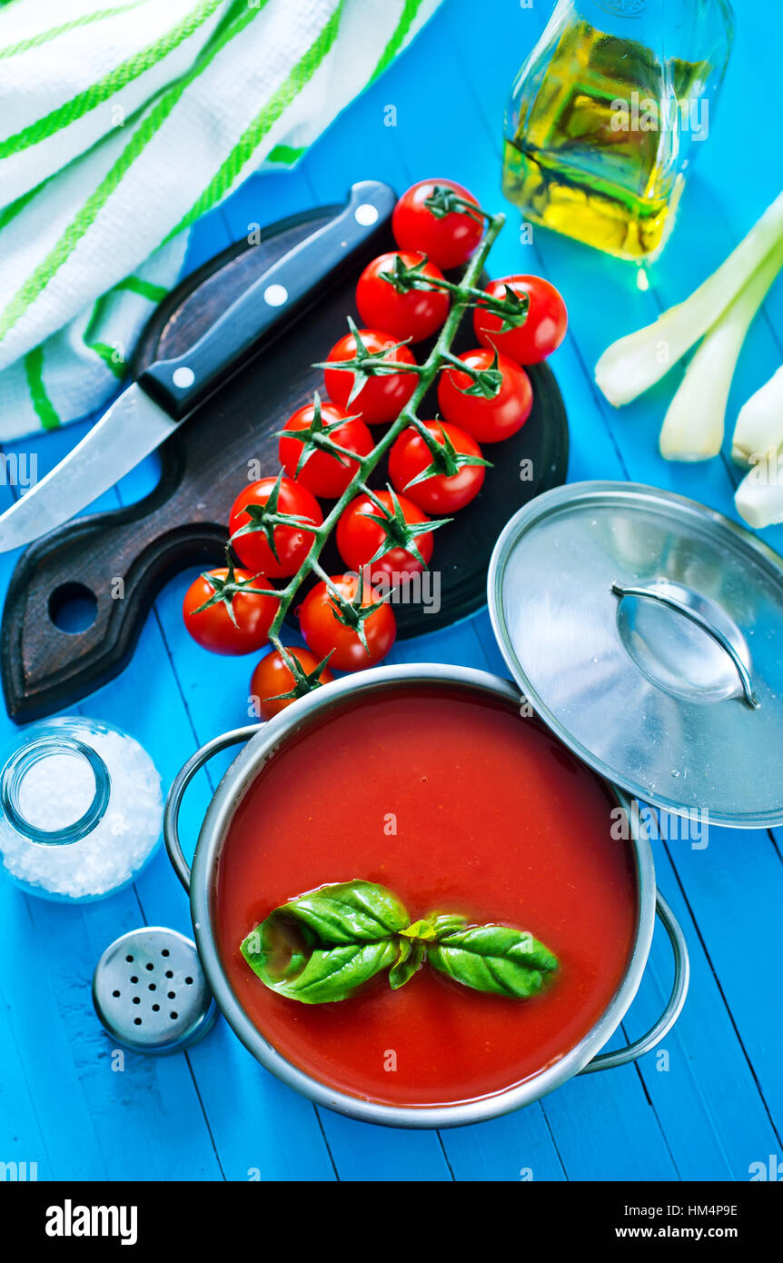 tomato soup in metal bowl and on a table Stock Photo - Alamy