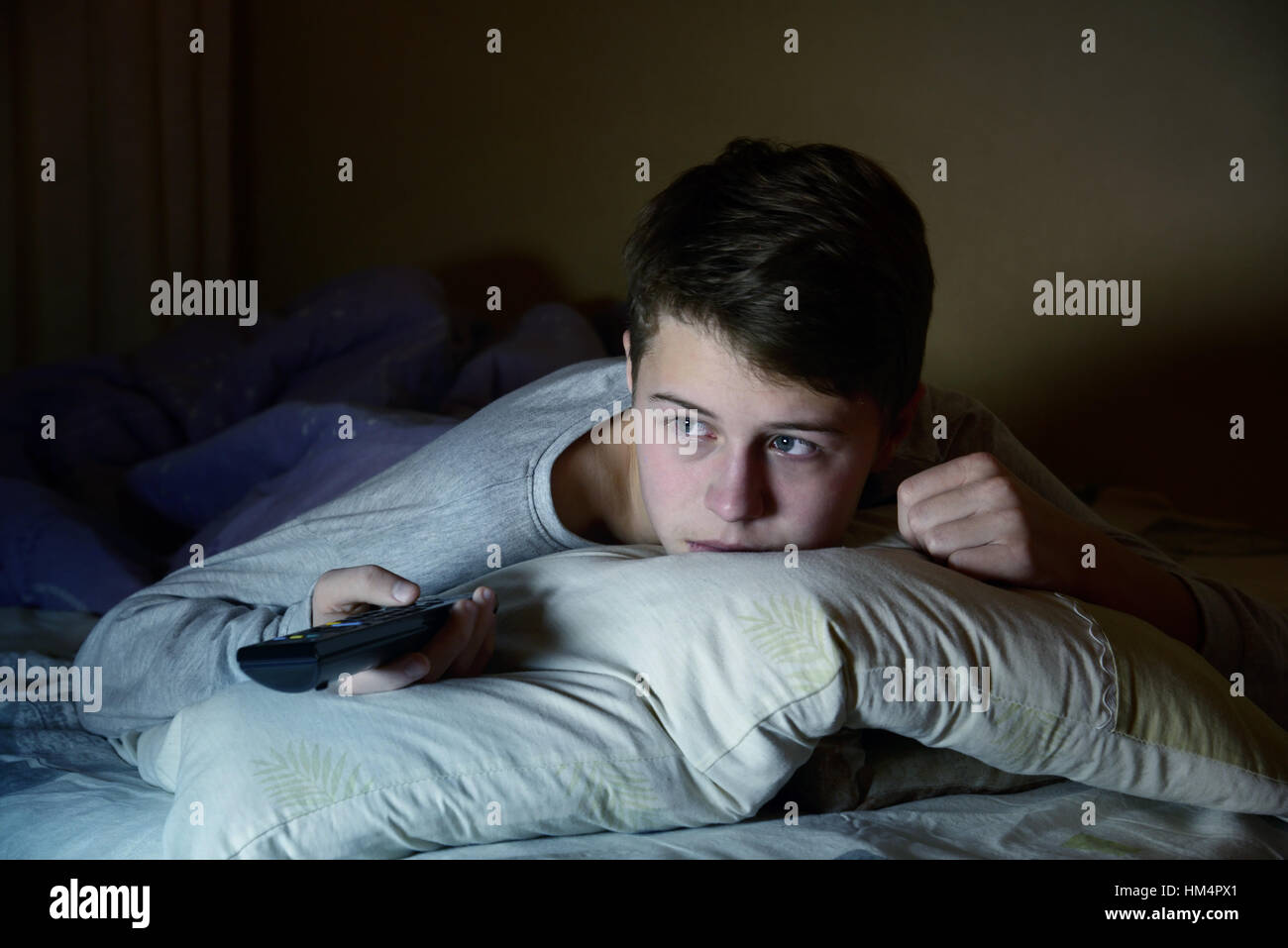 Person in bed watching tv hires stock photography and images Alamy