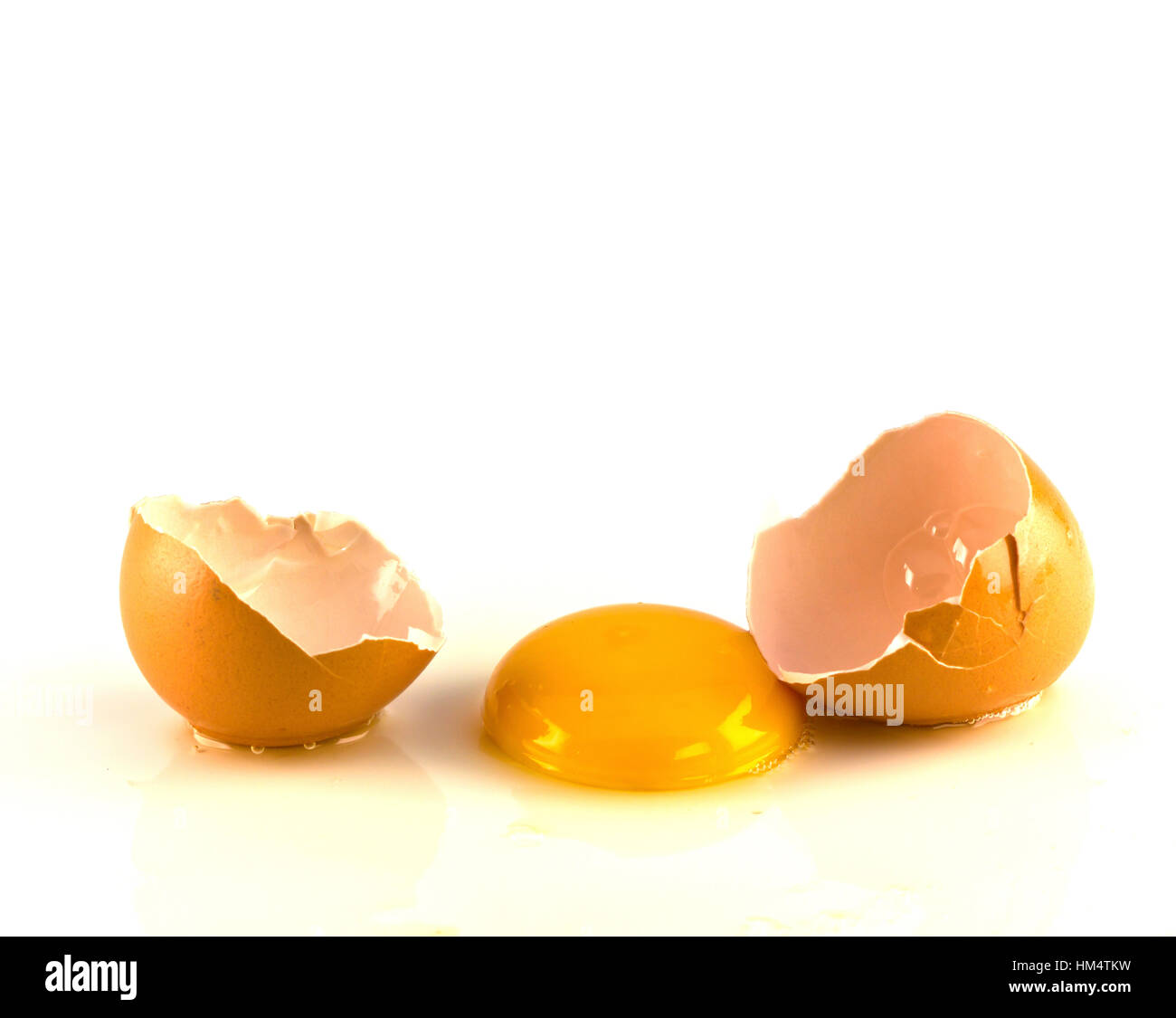 Broken egg isolated on white background Stock Photo - Alamy