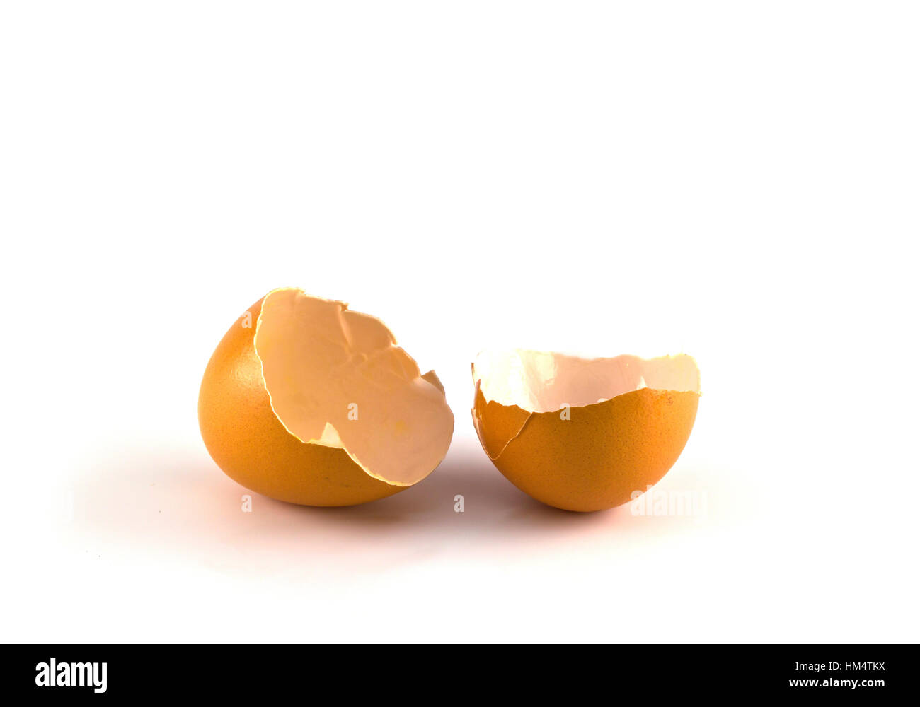 Broken egg isolated on white background Stock Photo - Alamy