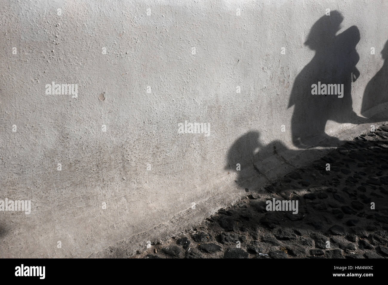 Shadows on a wall in Oia, Santorini, Greece Stock Photo