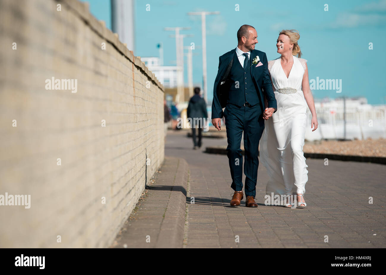 A couple look elated on their wedding day as they are married in Sussex, UK. Stock Photo