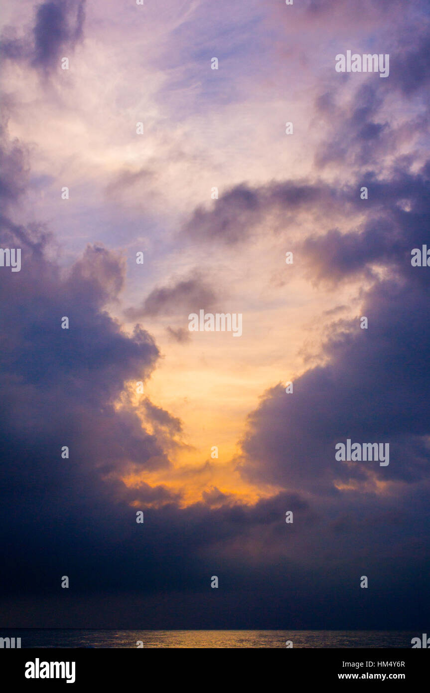 Stormy sky with a cloud highlighted by sun at sunset Stock Photo - Alamy