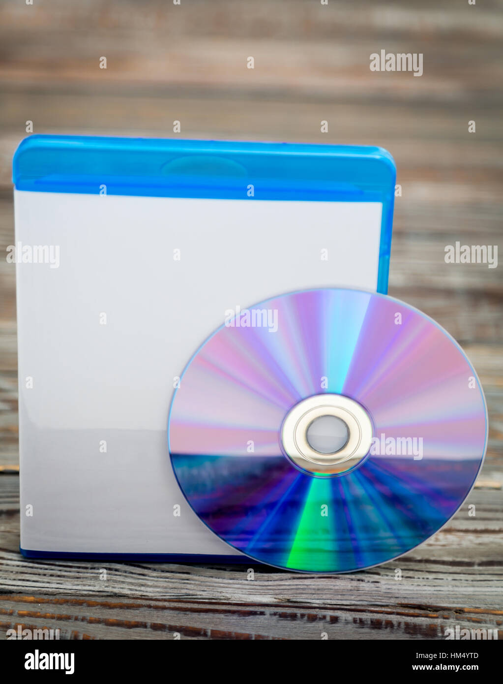 Blank compact disc with cover on wood background ground Stock Photo - Alamy