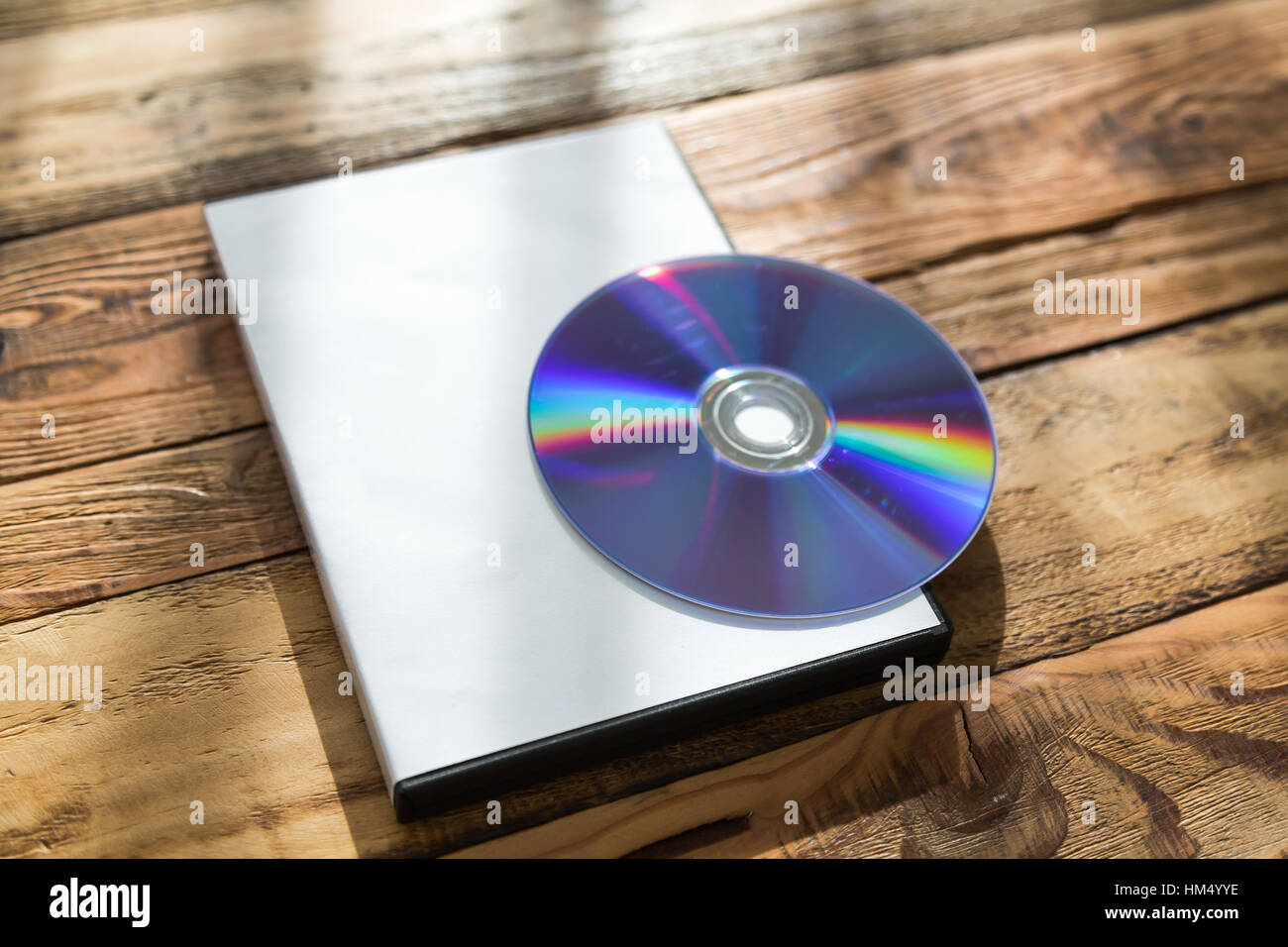 Blank compact disc with cover on wood background ground Stock Photo - Alamy