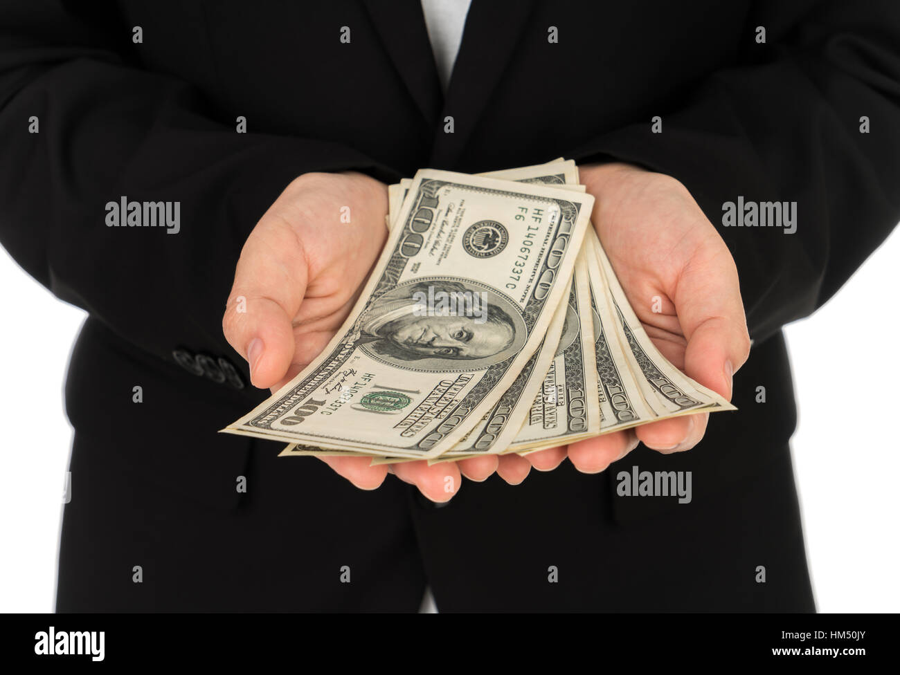 Business man Displaying a Spread of Dollar Stock Photo - Alamy