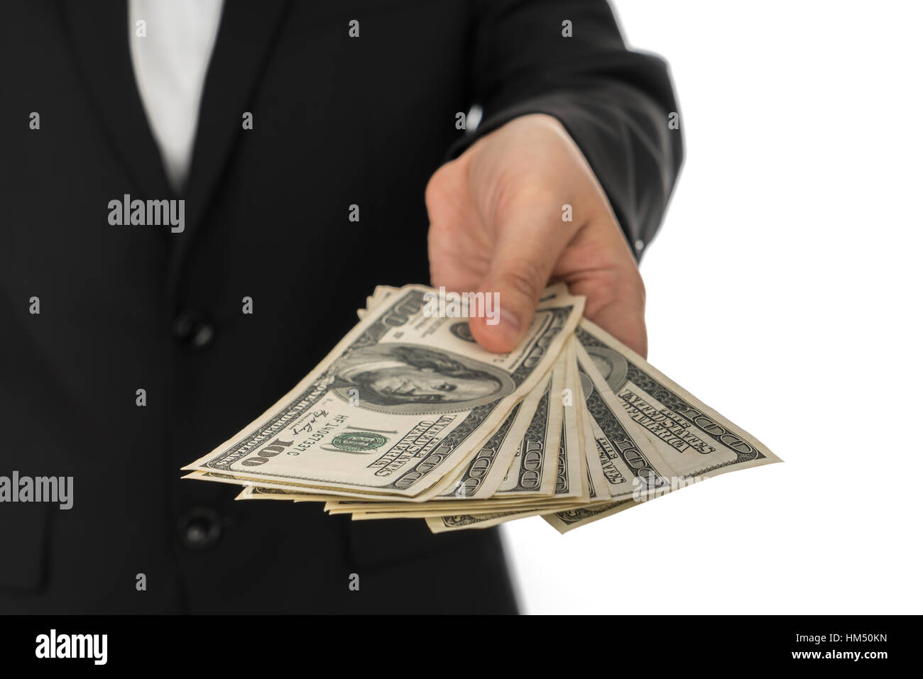 Business man Displaying a Spread of Dollar Stock Photo - Alamy