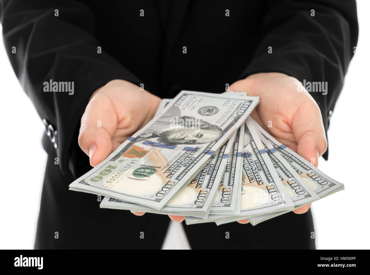 Business man Displaying a Spread of Dollar Stock Photo - Alamy